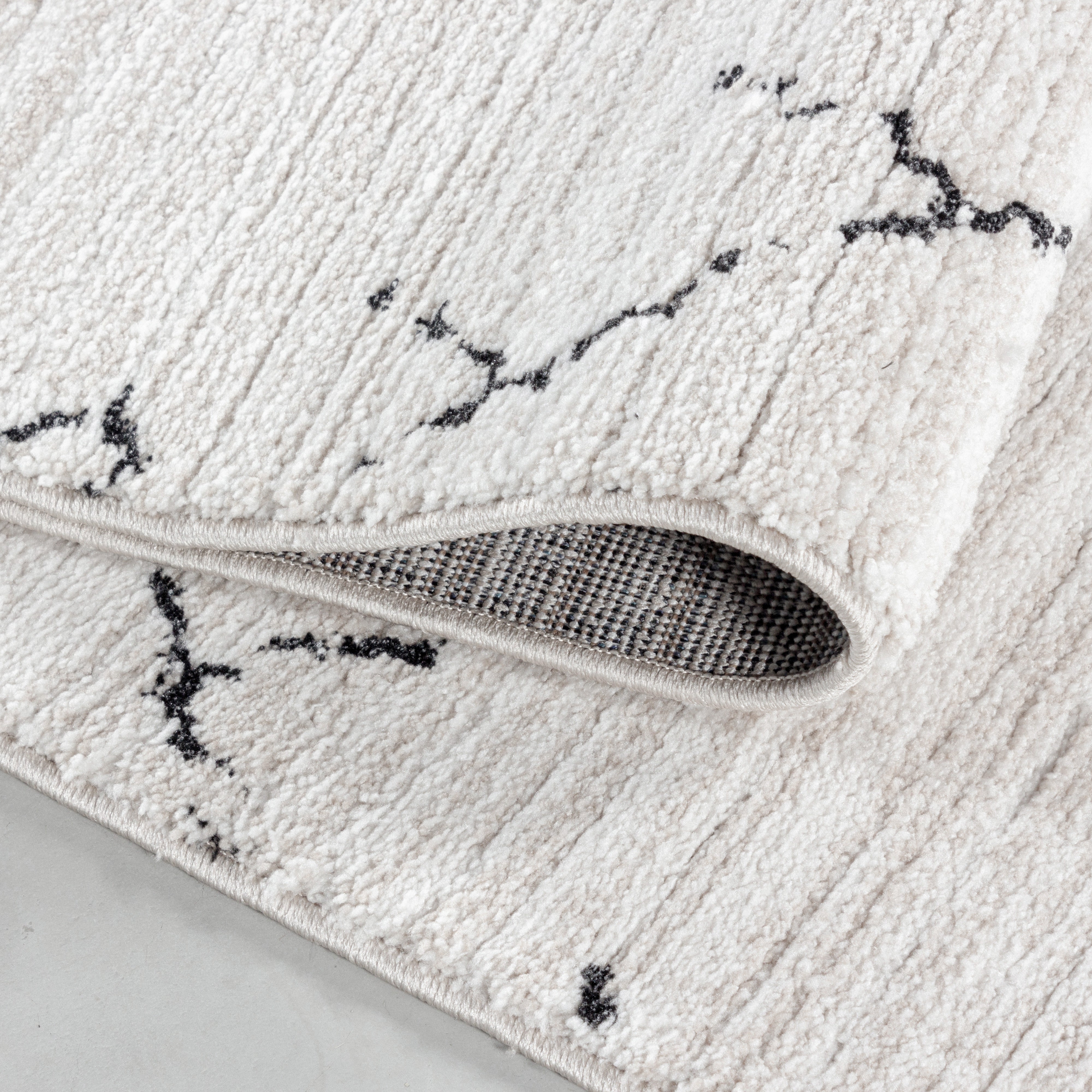 Kurzflor-Teppich im Berber-Design fürs Wohnzimmer