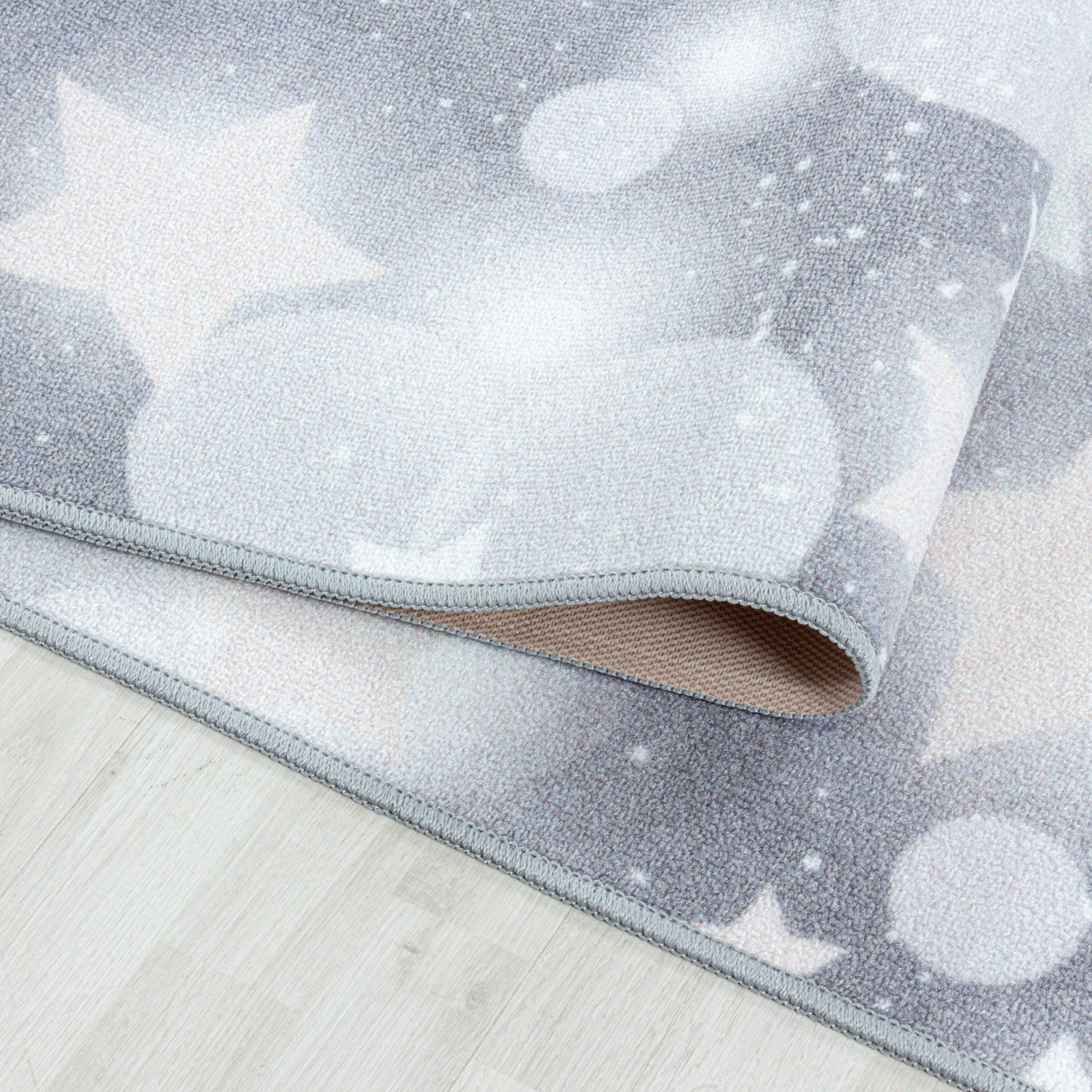 Kinder-Teppich hell leuchtende Sterne grau